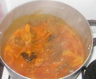 Nigerian groundnut soup base cooking in a pot